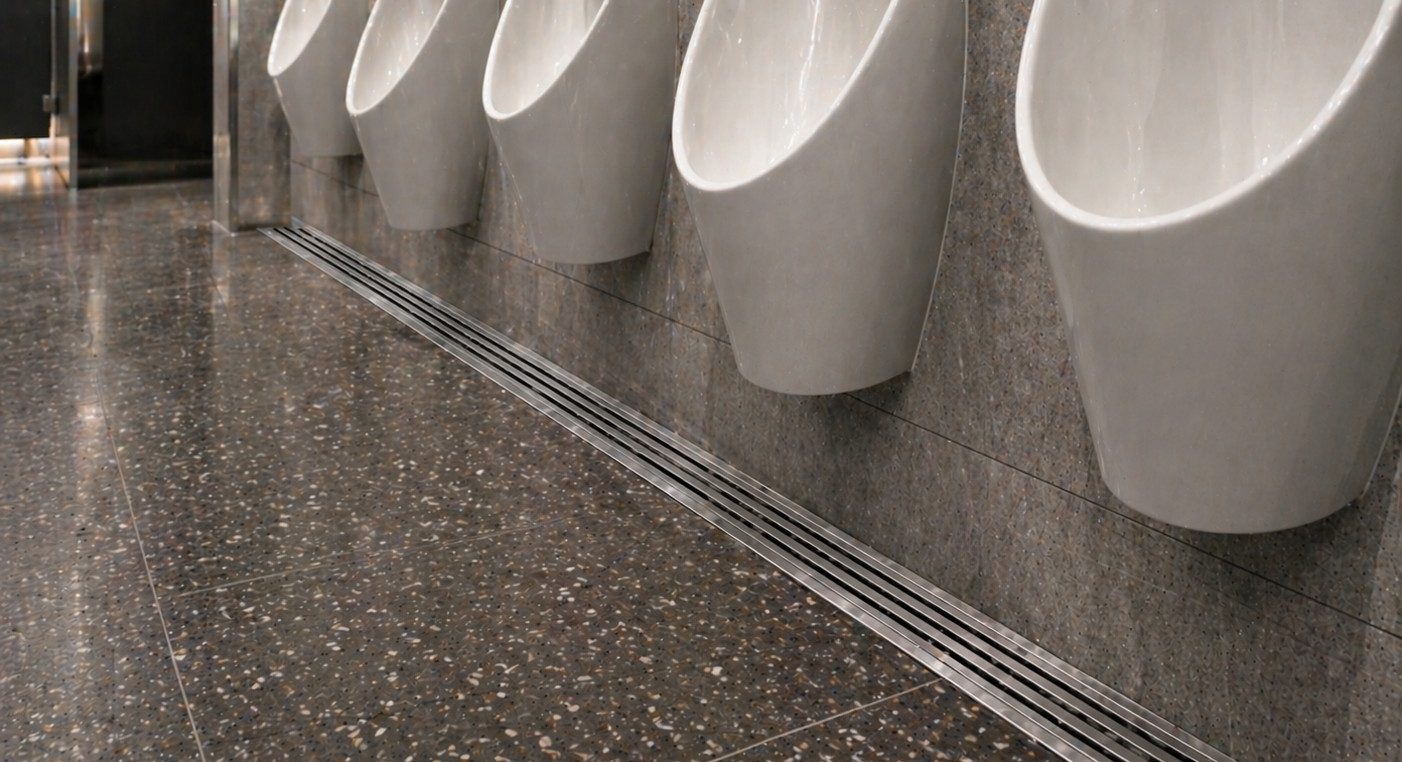 Auswave stainless steel drainage grates — commercial retail bathroom specification