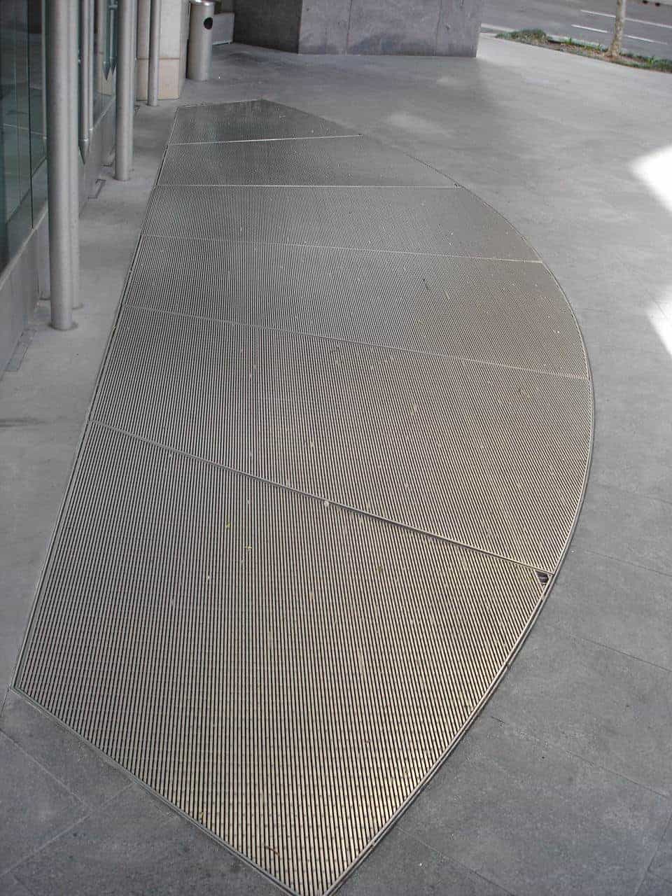 Auswave stainless steel civil drainage grates — premium commercial precinct specification